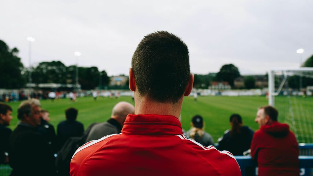 A person watching a football game.
